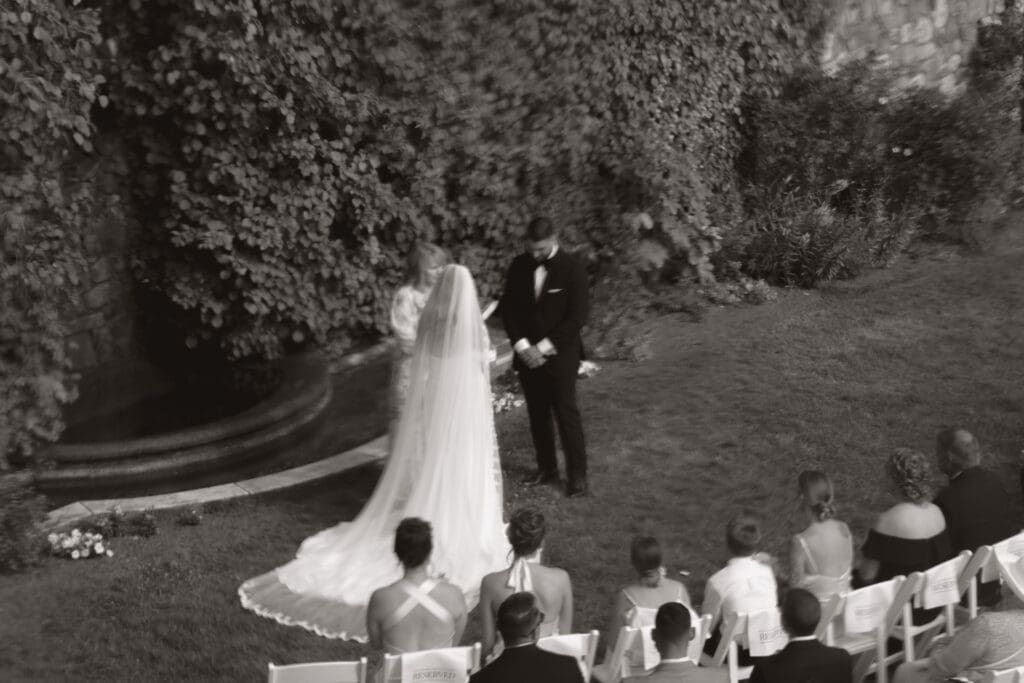 Blurry photo of the bride and groom at the alter getting married.