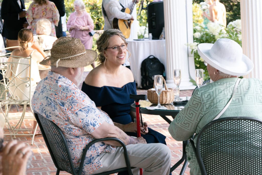 People laughing during cocktail hour.
