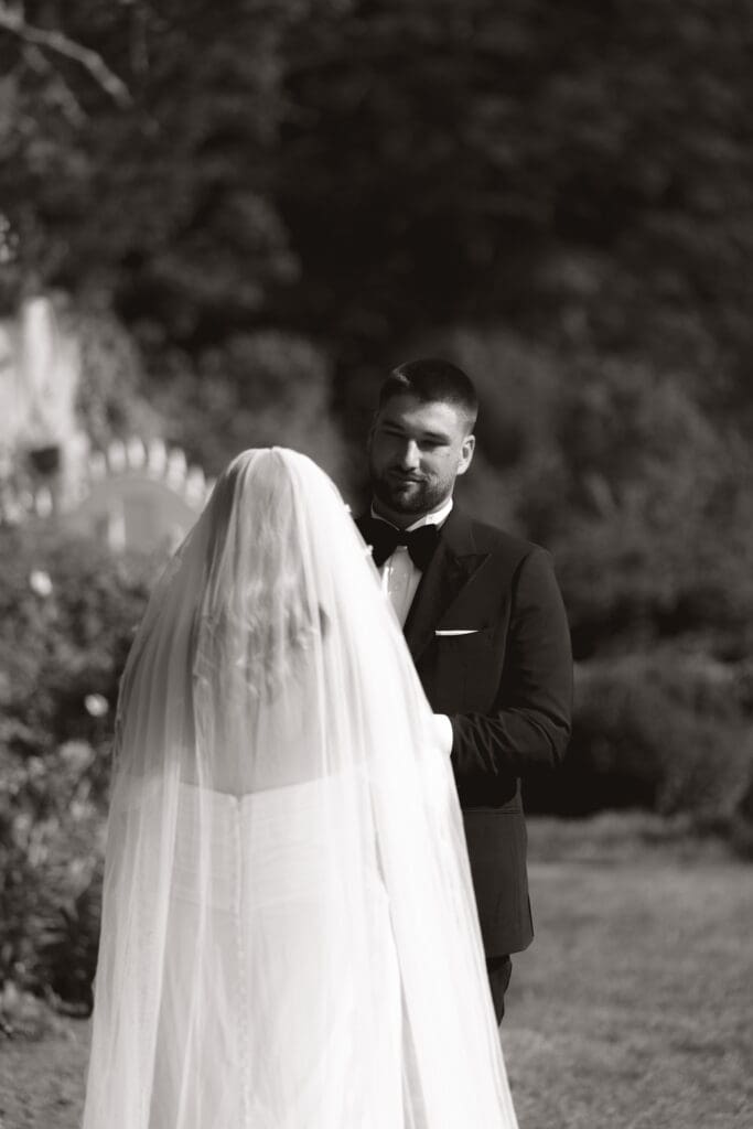 Bride and groom in black and white at the alter.