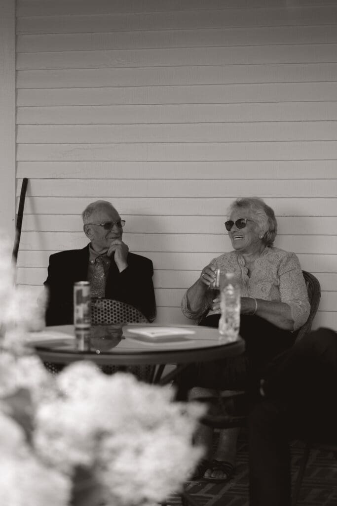 Grandma and Grandpa laughing during cocktail hour.
